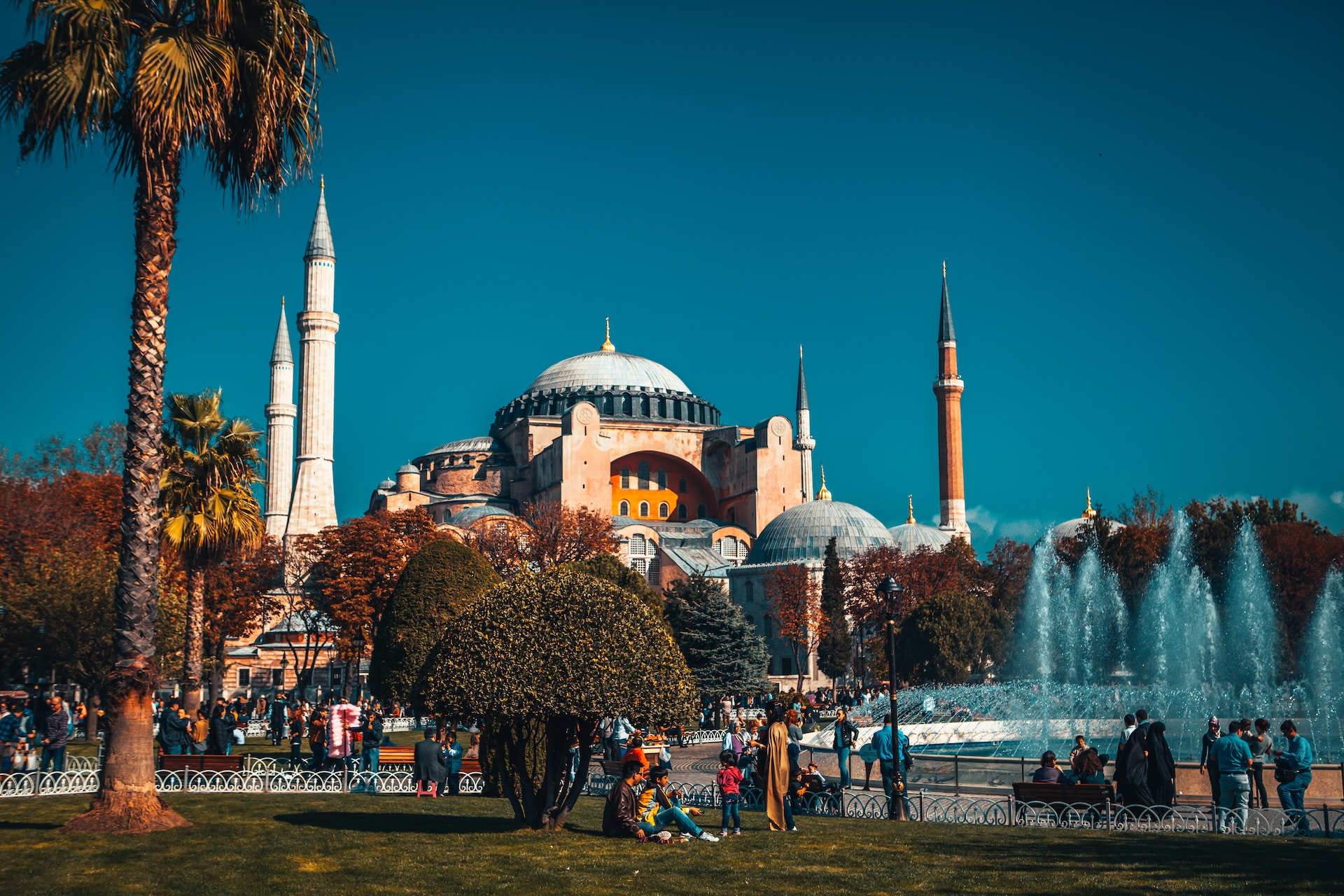 Blue mosque with fountain and garden in Istanbul on a clear blue sky day